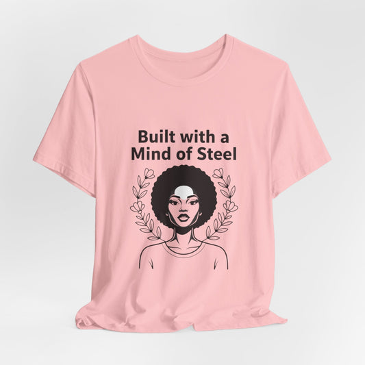 Pink women's t-shirt with an Afro woman illustration and the quote 'Built with a Mind of Steel'.